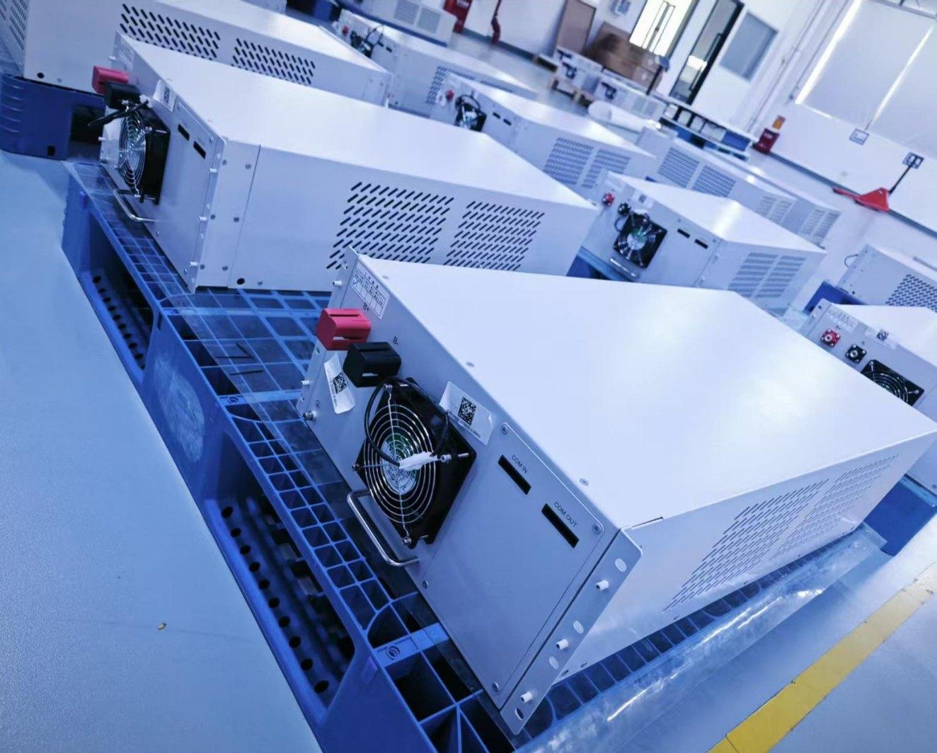 Battery modules on pallets on a factory floor